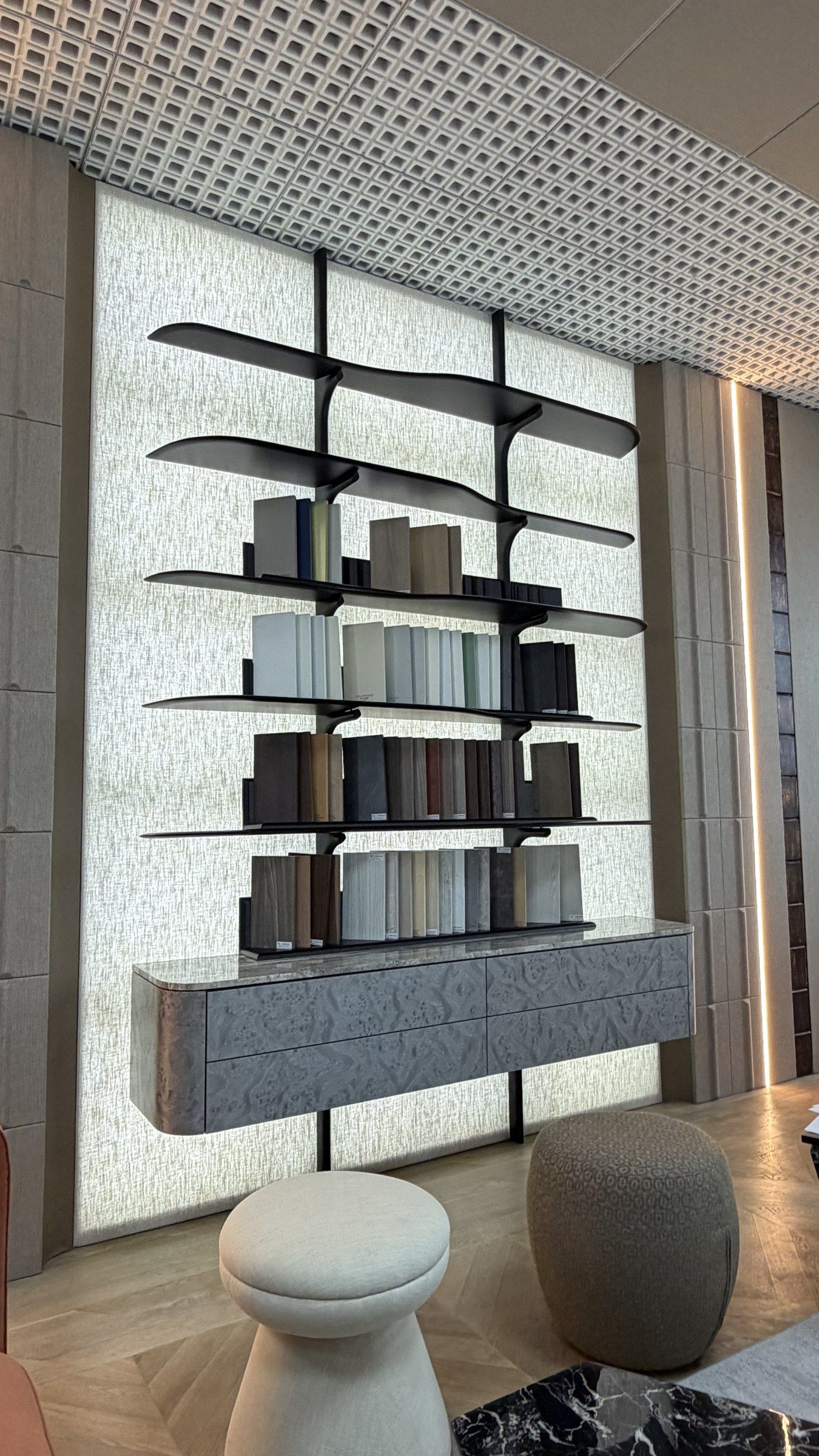 Shelving wall of textile and finish samples