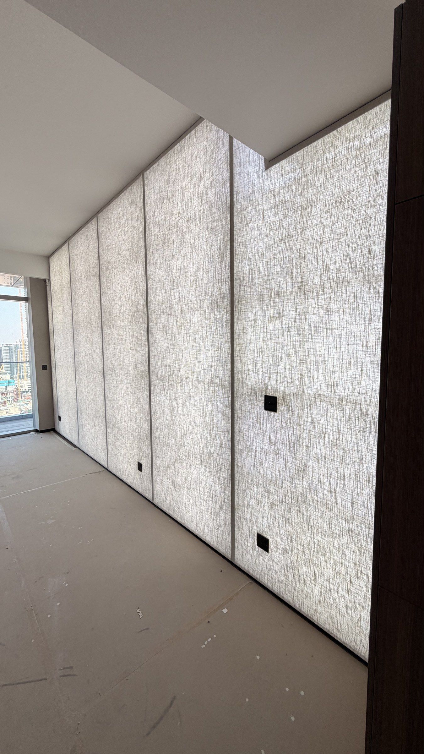 Office wall finished in light architectural textile